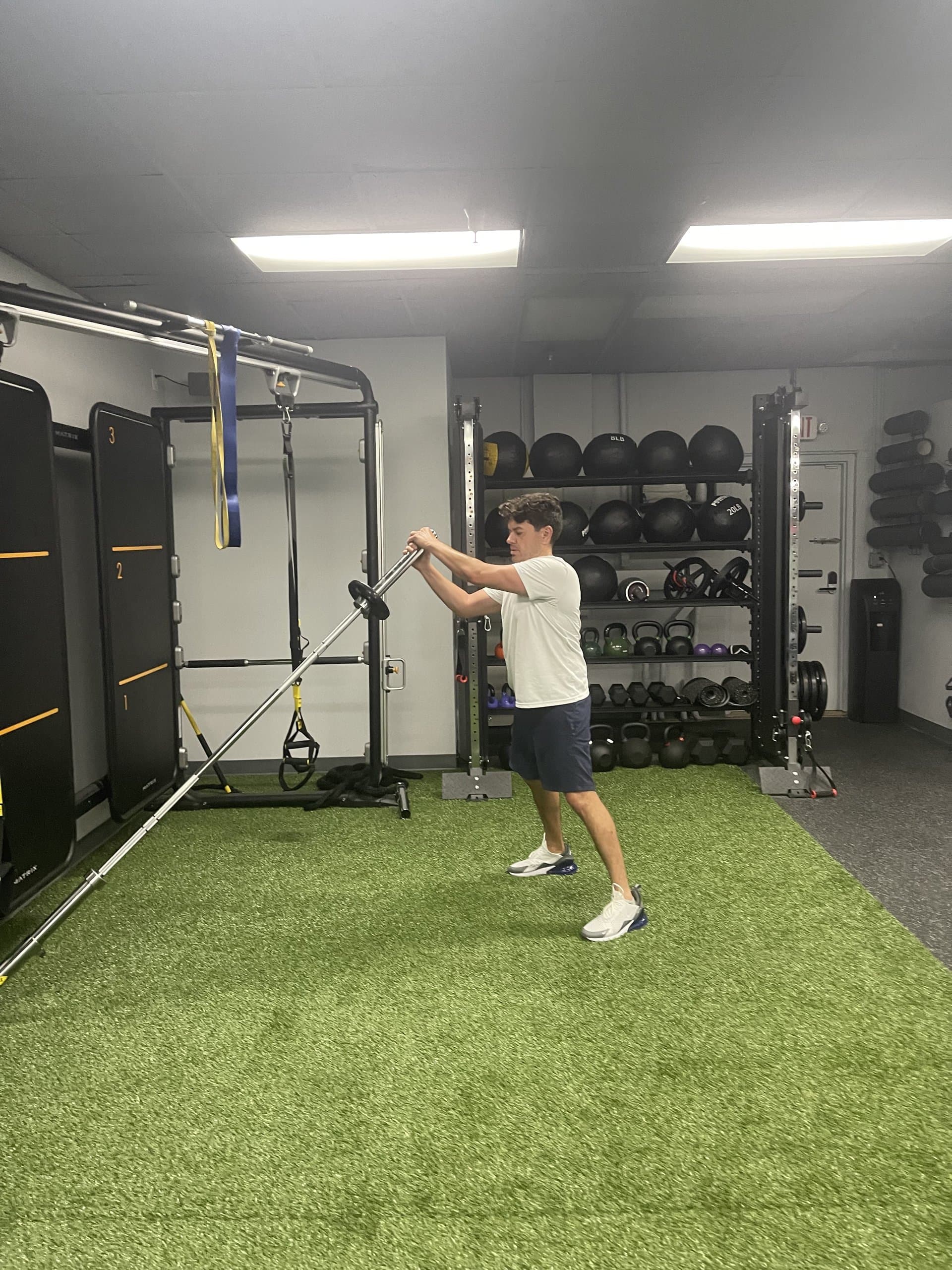 A young athlete performing a strength exercise at 838 Strength and Fitness in Monroe, CT