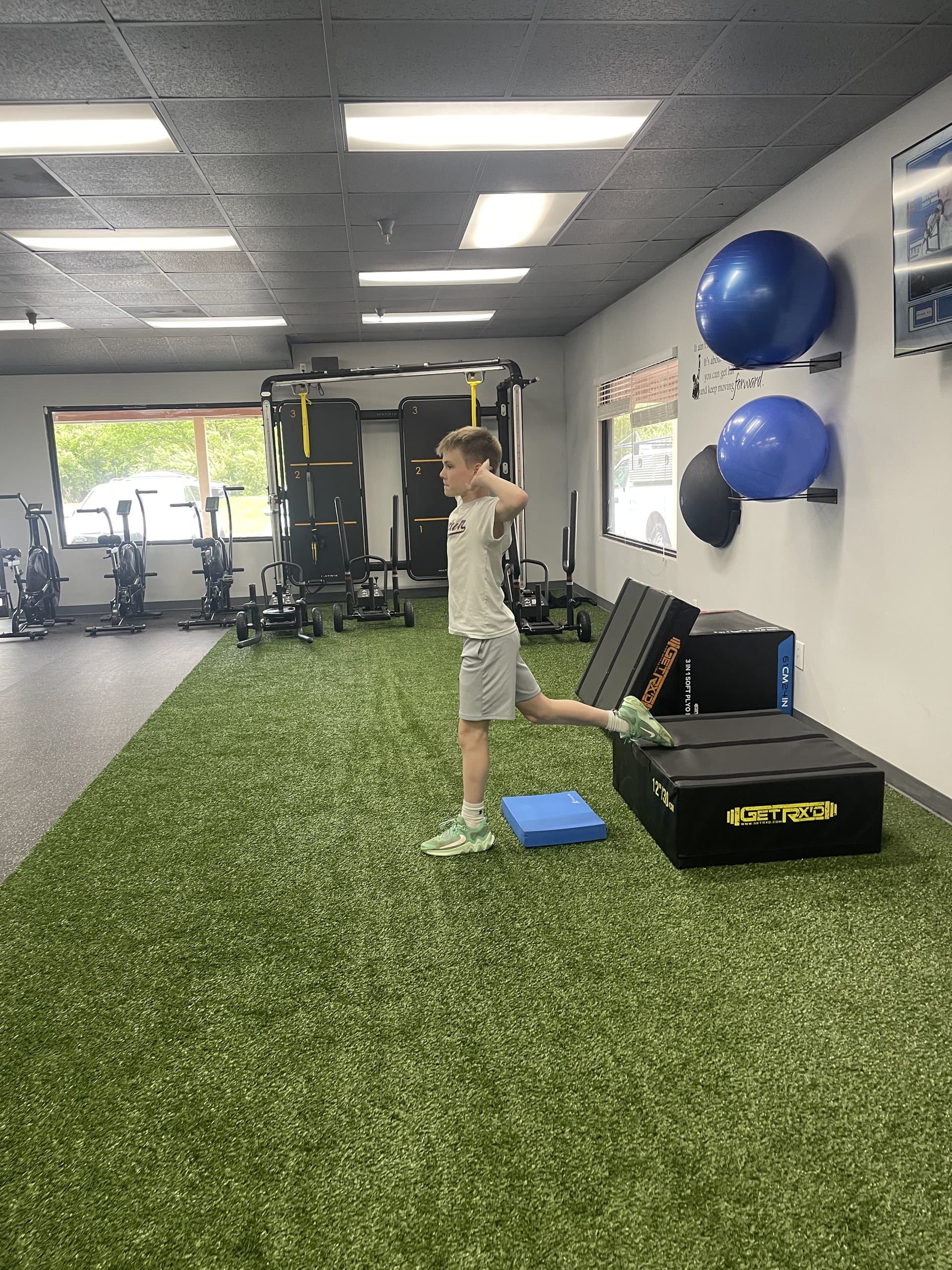 A young athlete on a single-leg balance drill at 838 Strength and Fitness in Monroe, CT