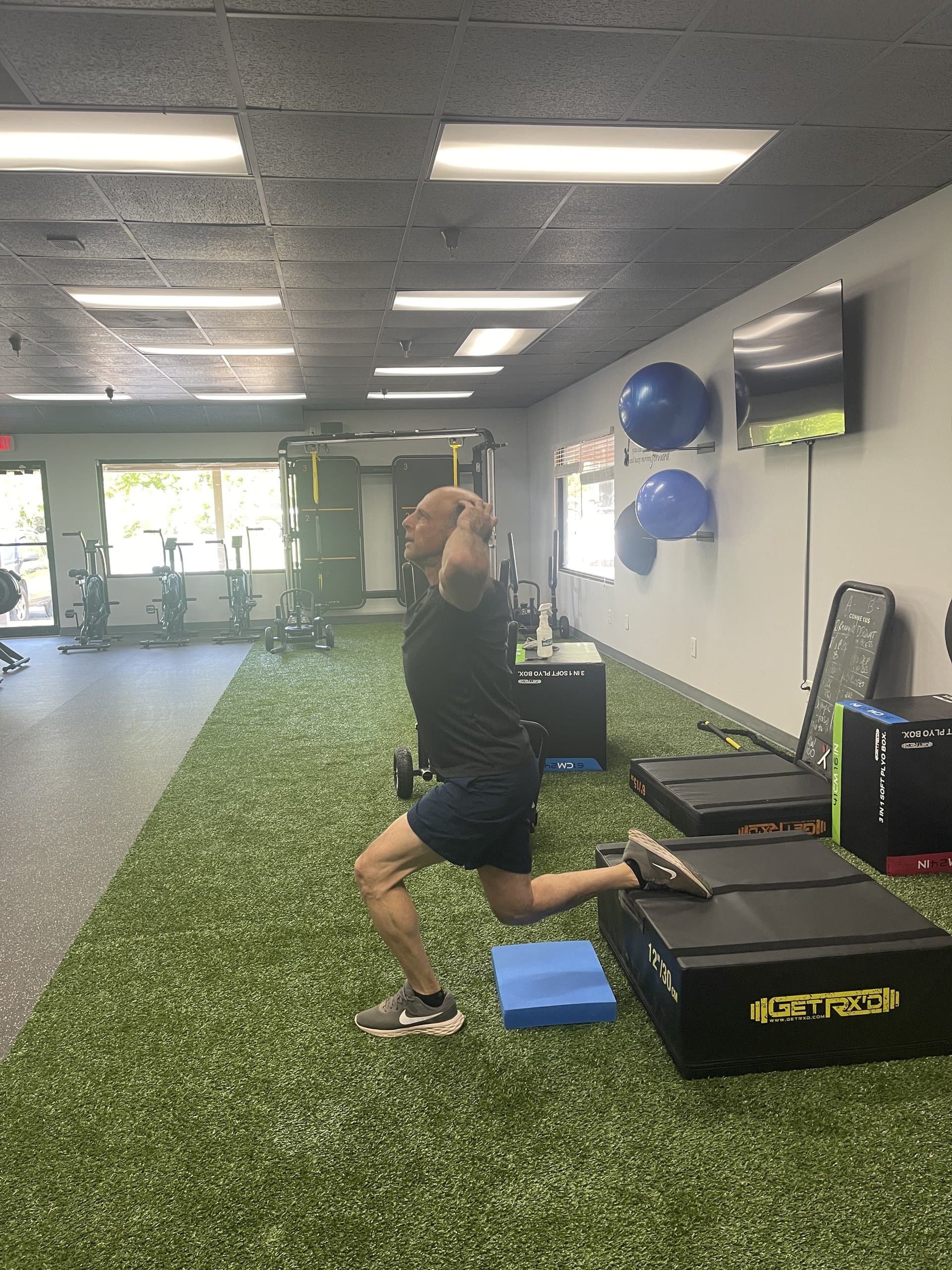 A member performing lunges at 838 Strength and Fitness in Monroe, CT
