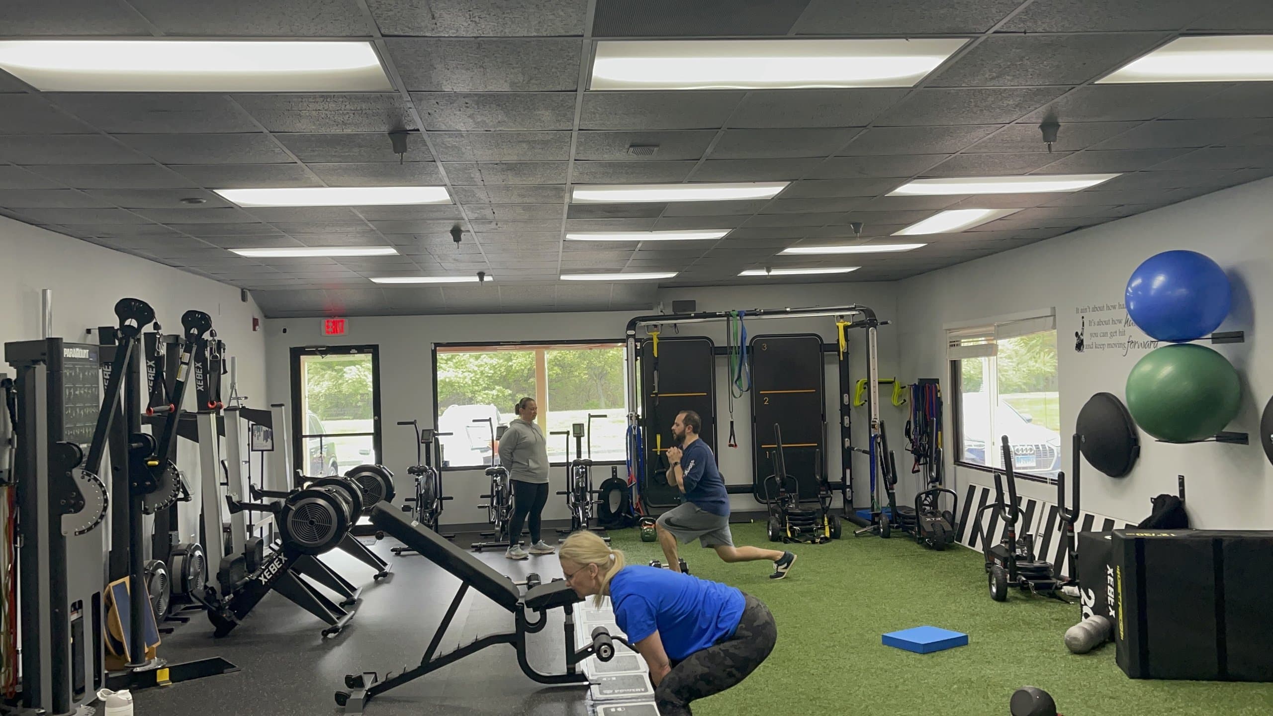 Three members training at 838 Strength and Fitness in Monroe, CT