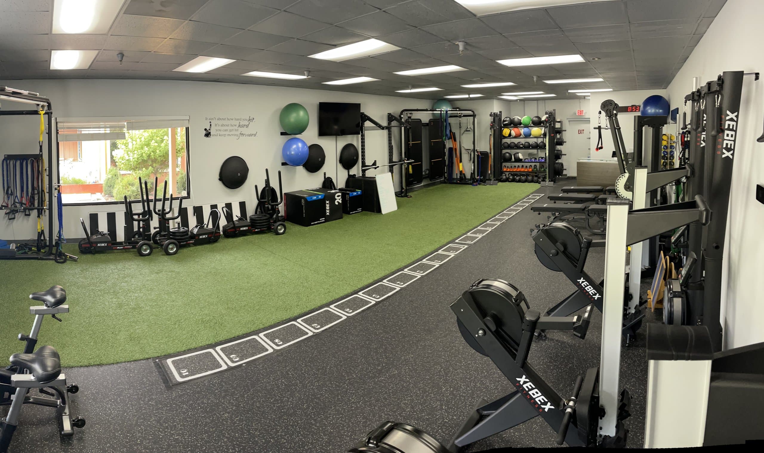The turf training area and rowing machines at 838 Strength and Fitness in Monroe, CT
