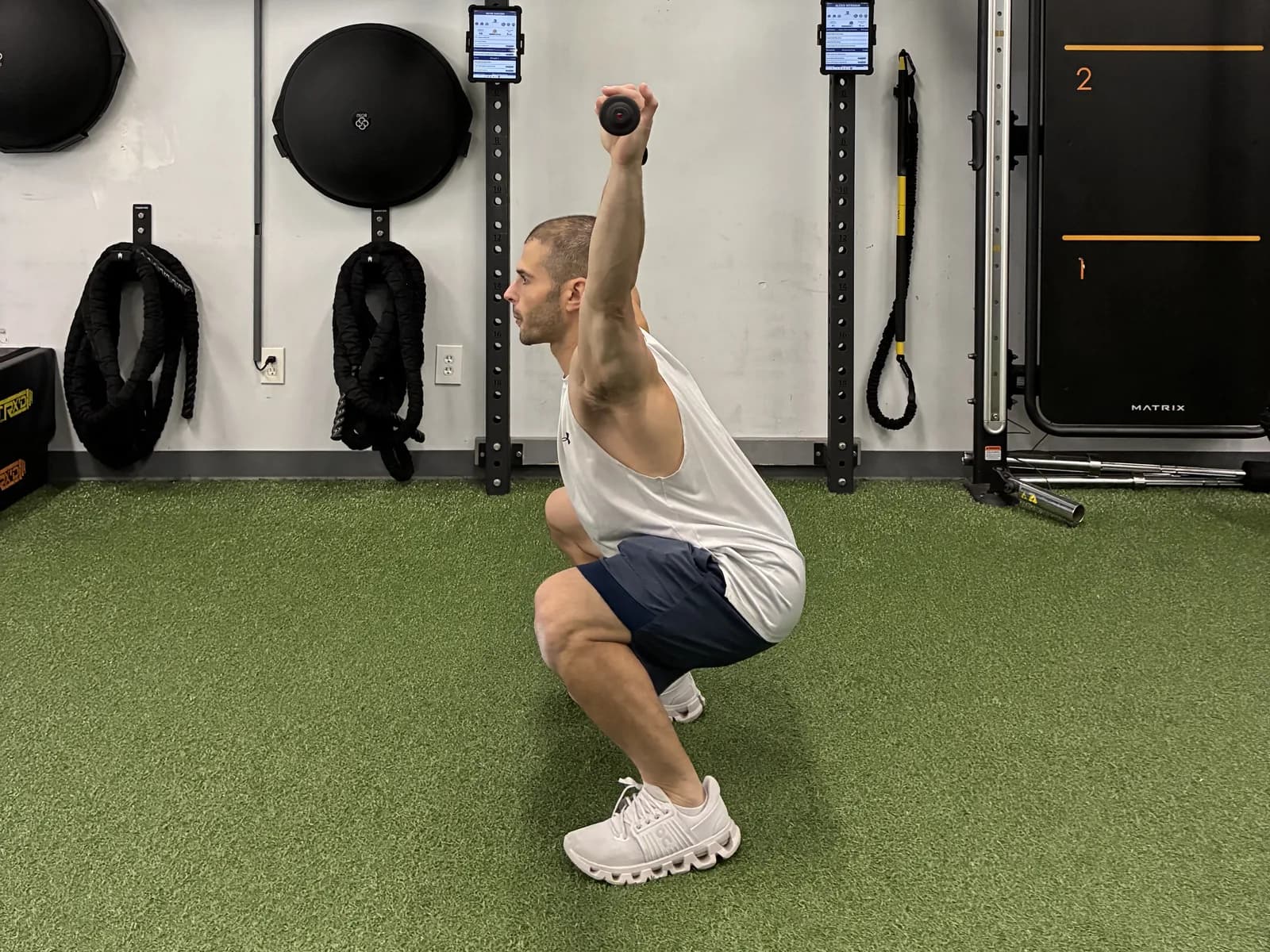 A coach-led overhead squat assessment during the Functional Movement Screen at 838 Strength and Fitness
