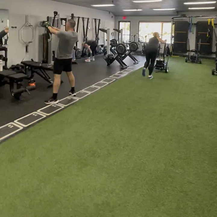 Members training on the turf during a semi-private session at 838 Strength and Fitness