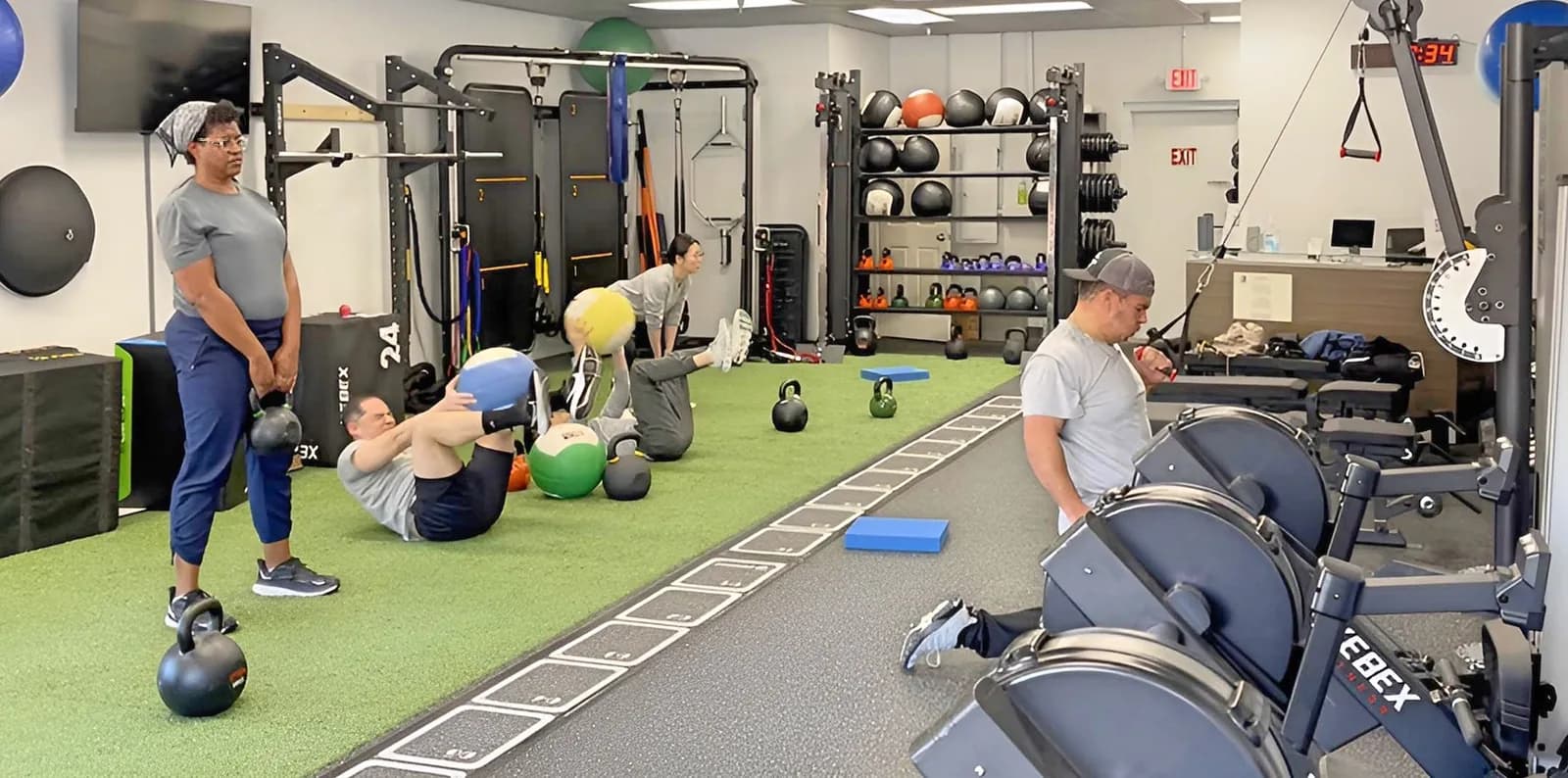 Members doing different exercises during a semi-private session at 838 Strength and Fitness